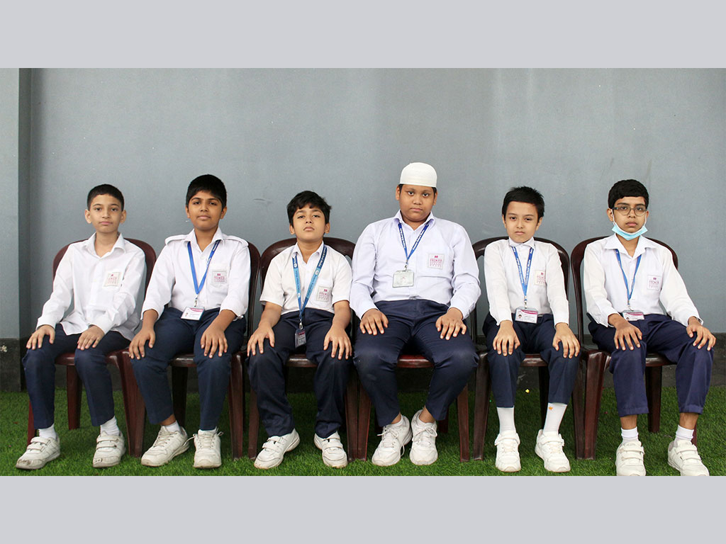Primary Years Students of 4 Boys Wearing School Uniform